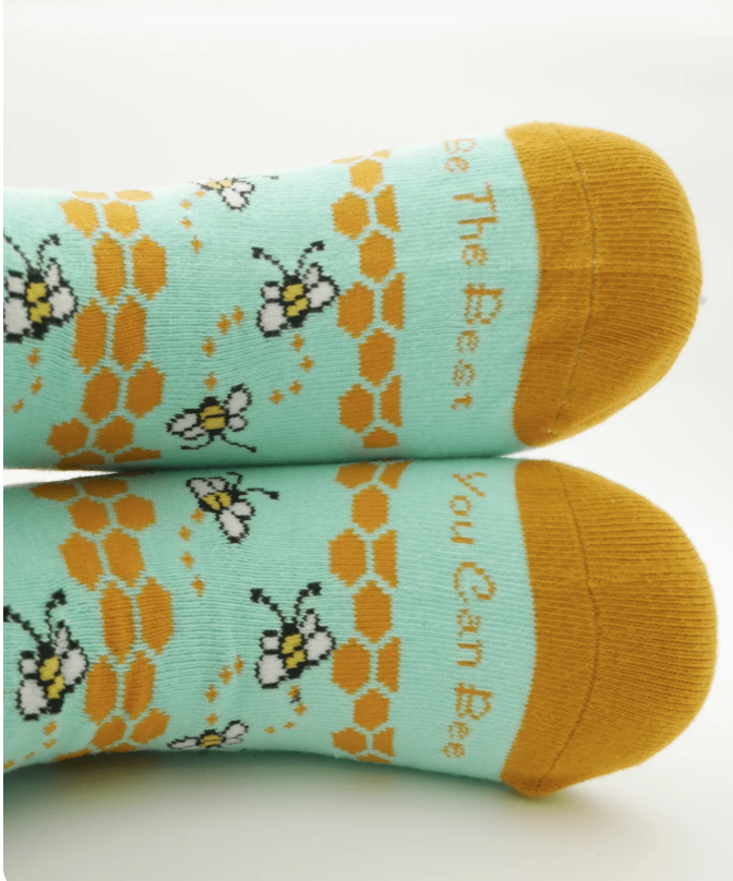 Yellow and pale turquoise socks with a bee design
